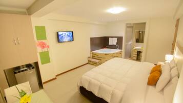 Junior Suite, 1 King Bed, Jetted Tub | In-room safe, desk, iron/ironing board, free WiFi
