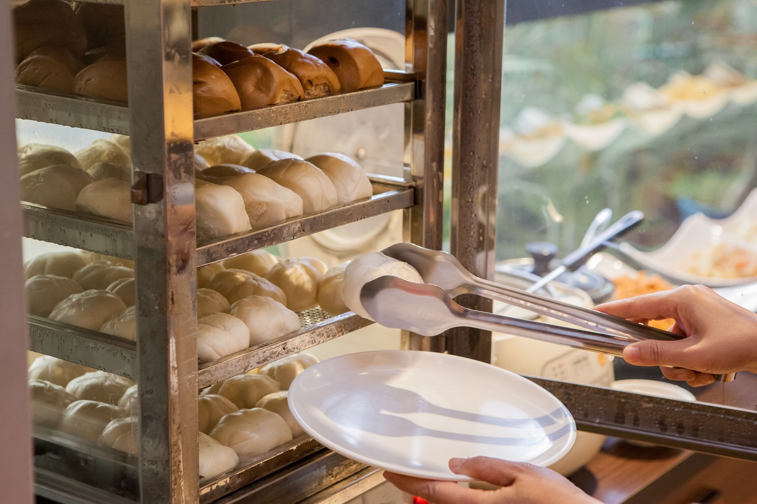 A bakery display case with various baked goods.