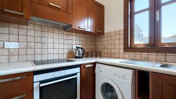 Apartment | Private kitchen | Full-size fridge, microwave, oven, stovetop