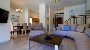 Villa | Living area | 42-inch flat-screen TV with satellite channels, TV, Netflix