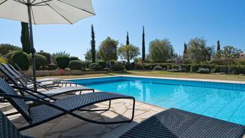 Outdoor pool, pool umbrellas, sun loungers