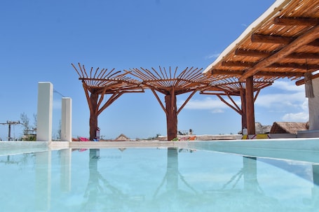 2 outdoor pools, open 7:00 AM to 10:00 PM, pool umbrellas, sun loungers