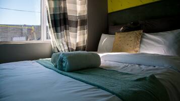 Ropa de cama de alta calidad y tabla de planchar con plancha