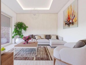 A modern living room with a sofa, a coffee table with flowers, a potted plant, and a painting on the wall. - Villa Subic (Rab)