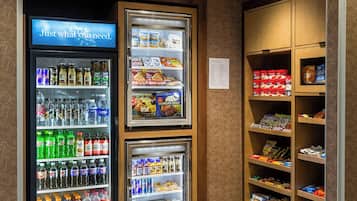 A vending area with various drink and snack options, including refrigerated and non-refrigerated sections.