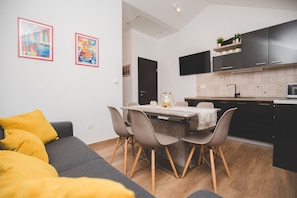 Comfort Apartment, 1 Queen Bed, Hot Tub, Sea View | Living area | 109-cm flat-screen TV with digital channels, Smart TV, iPod dock
