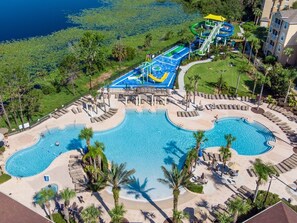 Outdoor pool, a heated pool, sun loungers - RATED#1 BEST HOME Near Disney! LUXURY 5BEDROOM 5Bath VILLA ,GATED RESORT ,POOL (Kissimmee)