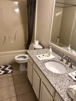 Combined shower/tub, hair dryer, towels, shampoo