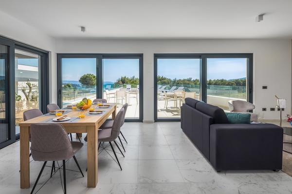 Deluxe Apartment, Sea View (1) | Living area | Flat-screen TV