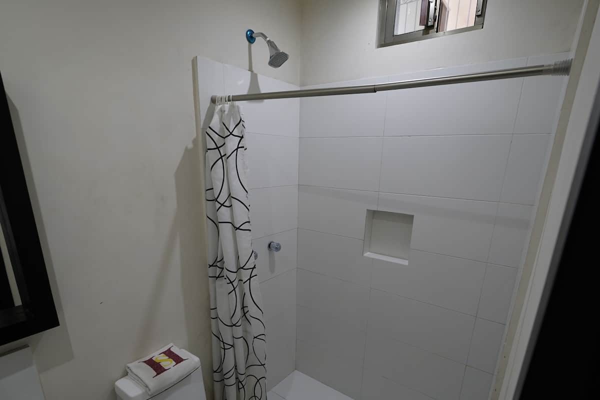 standard twin room | bathroom | shower, free toiletries, towels