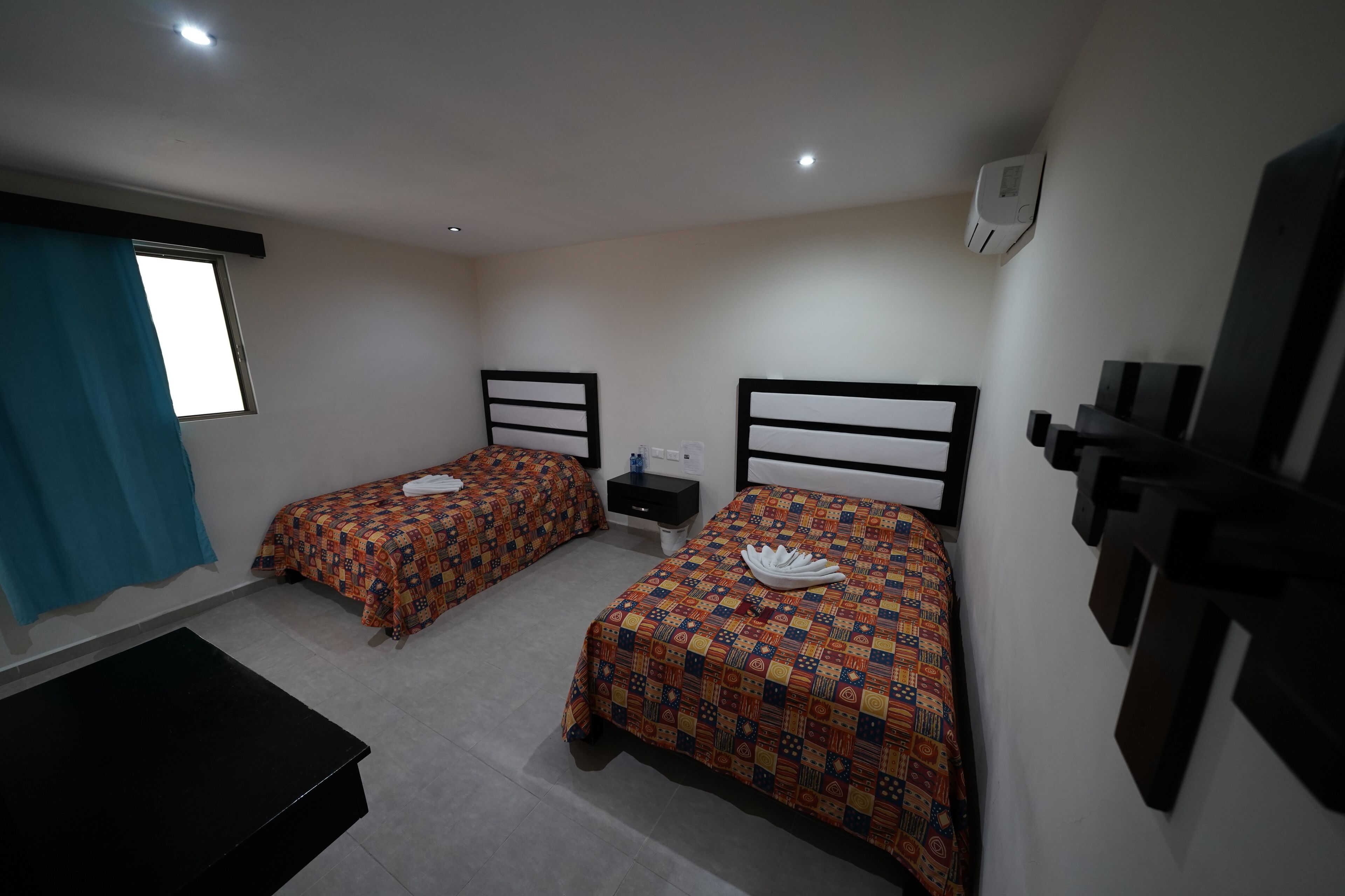 standard quadruple room, 2 double beds | 1 bedroom, desk, blackout curtains, iron/ironing board