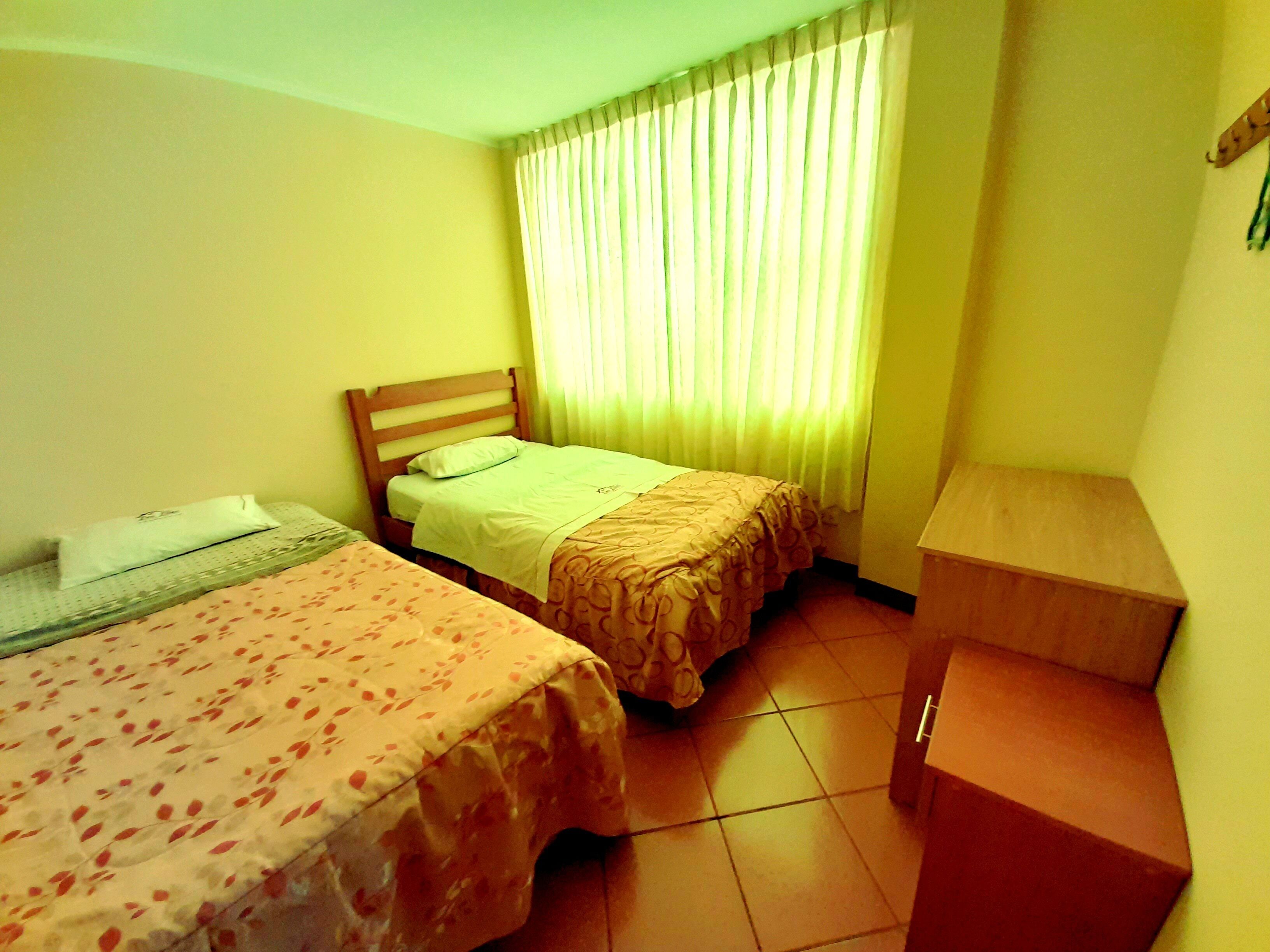 Departamento familiar, 2 habitaciones, baño privado, torre | Edredón, escritorio, wifi gratis y ropa de cama 