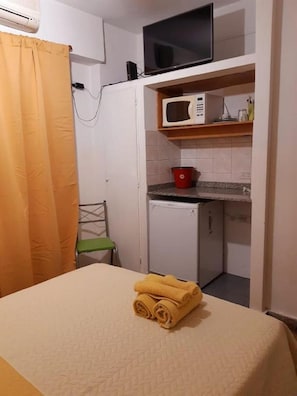 Fridge, microwave, stovetop, cookware/dishes/utensils