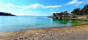 On the beach, sun-loungers