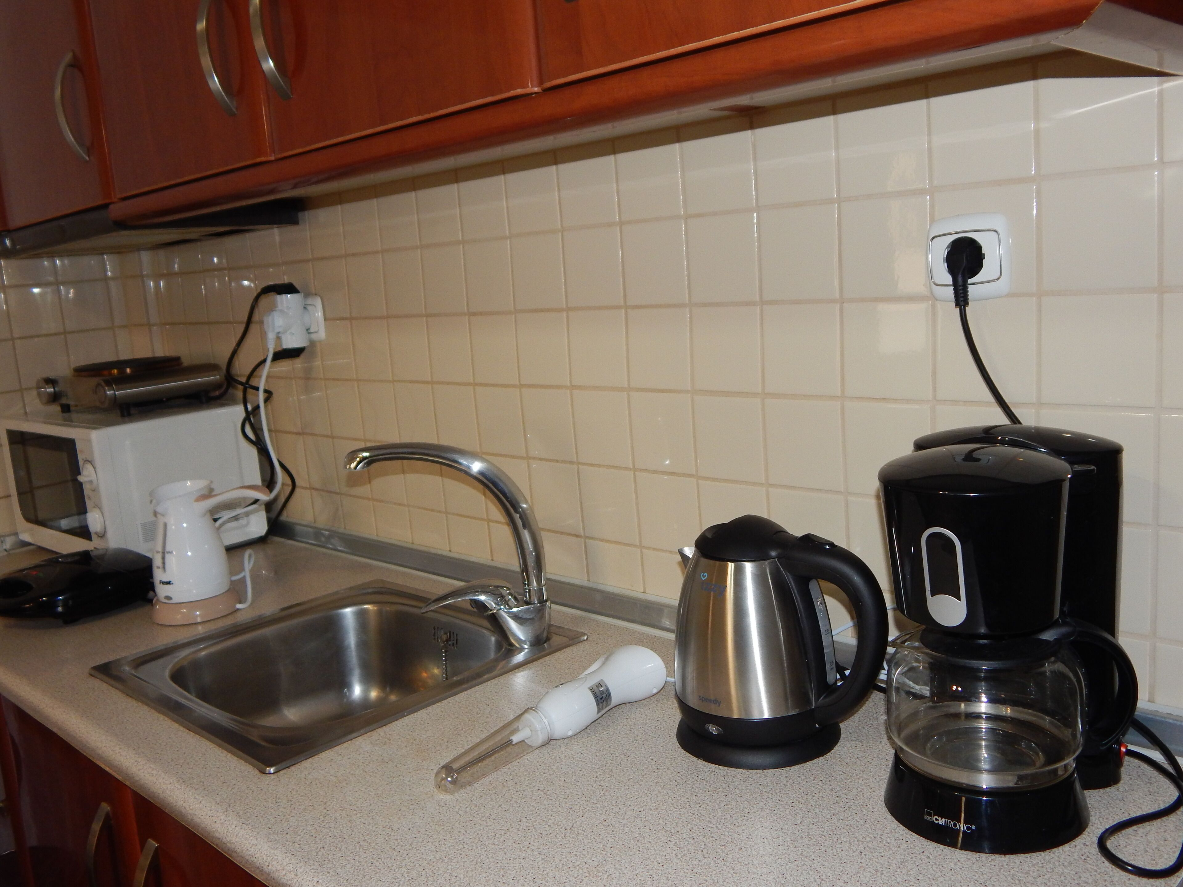 Fridge, coffee/tea maker, electric kettle, toaster