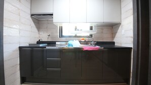 Room, Kitchenette (Condominium) | Private kitchenette | Fridge, shared microwave, electric kettle - Adios Hotel (Tongyeong)