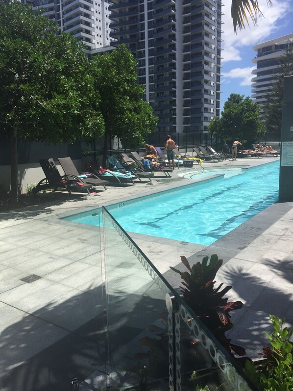 Outdoor pool, open 7:00 AM to 9:00 PM, pool umbrellas, pool loungers