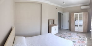 Premium bedding, blackout curtains, iron/ironing board