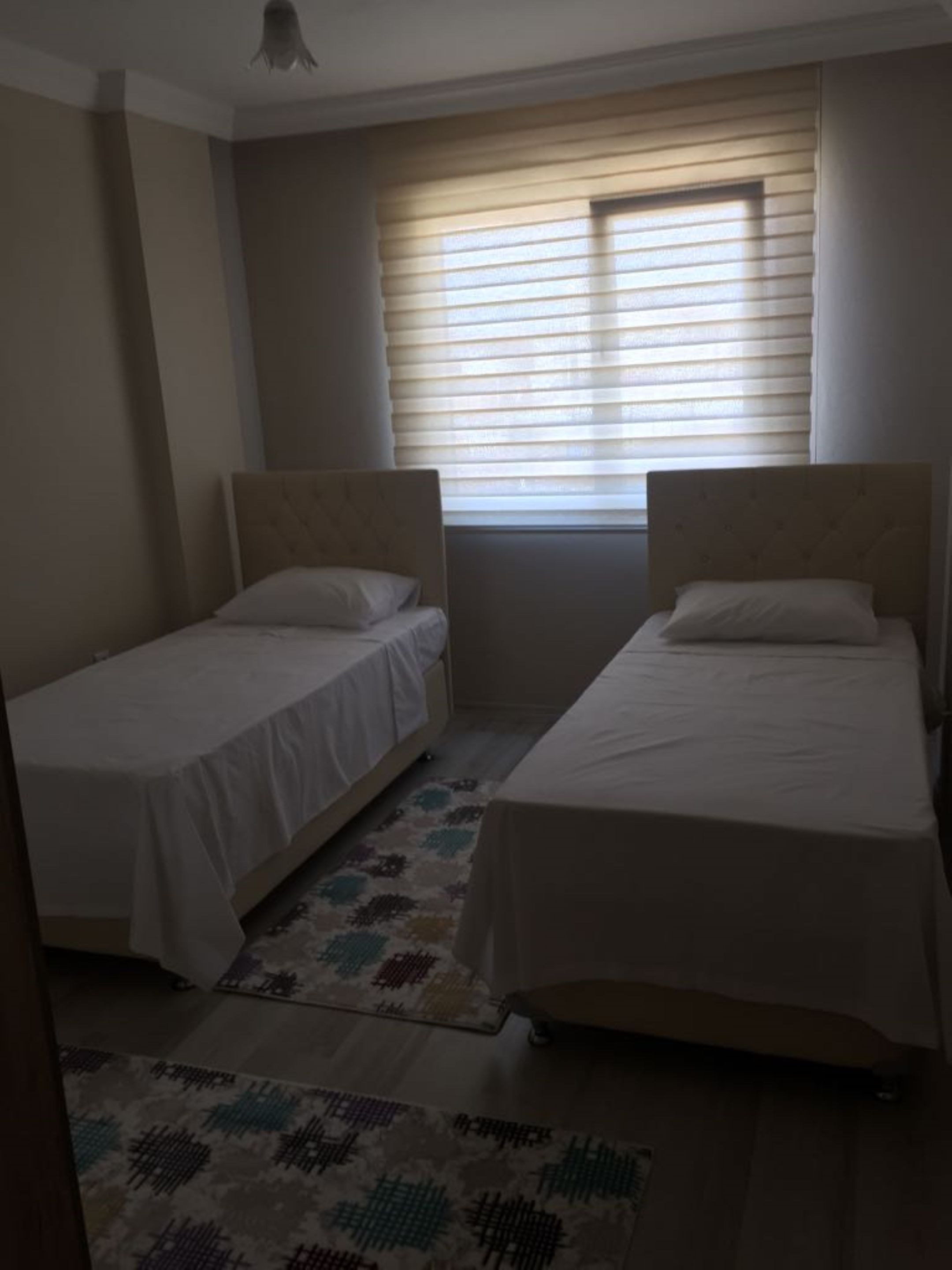 luxury apartment, multiple beds, city view | premium bedding, blackout curtains, iron/ironing board