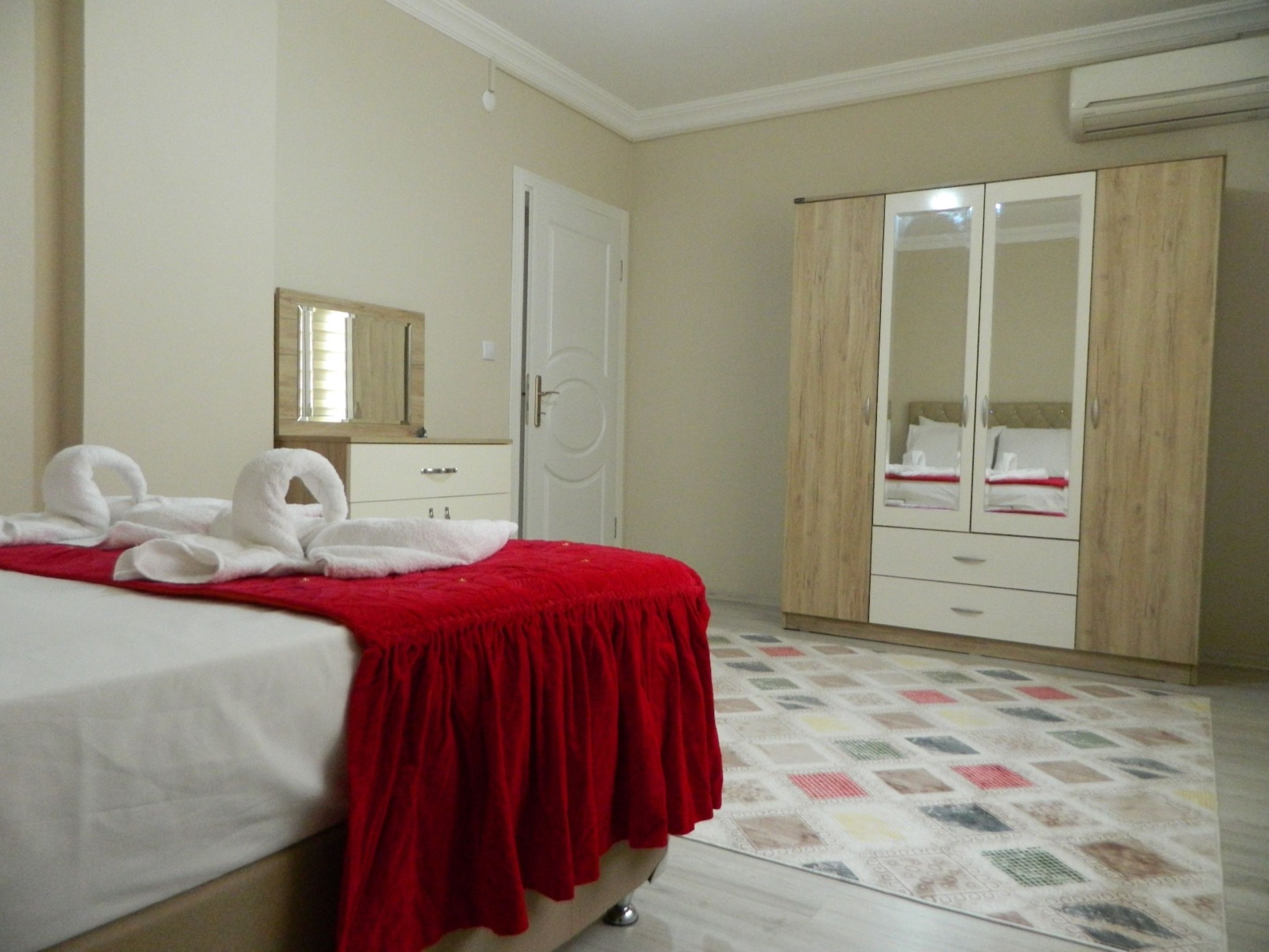 luxury apartment, multiple beds, city view | premium bedding, blackout curtains, iron/ironing board