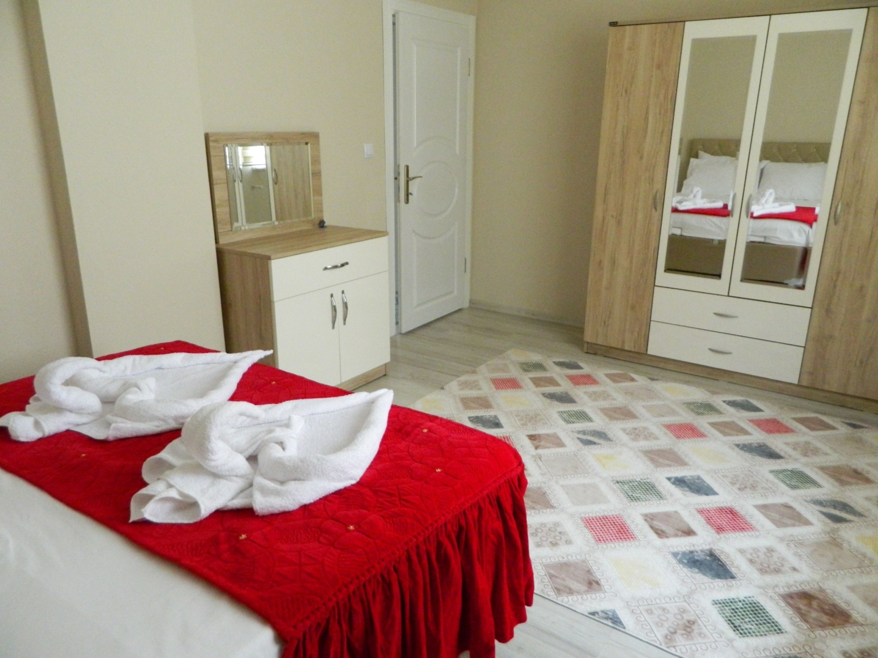 luxury apartment, multiple beds, city view | premium bedding, blackout curtains, iron/ironing board