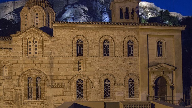A historic building with multiple arched windows and a bell tower. - Tripodon Plaka in the shade of Acropolis by GHH (Athens)