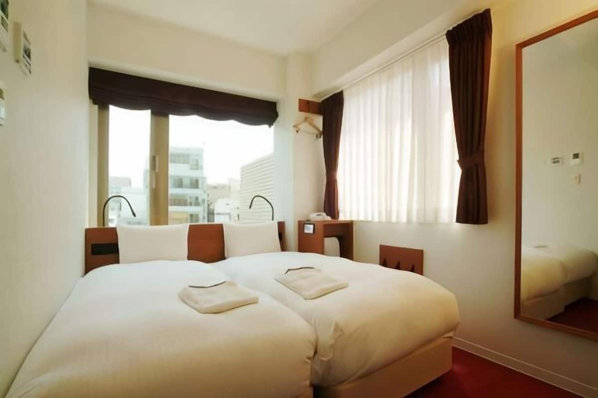 Down duvets, desk, blackout curtains, iron/ironing board