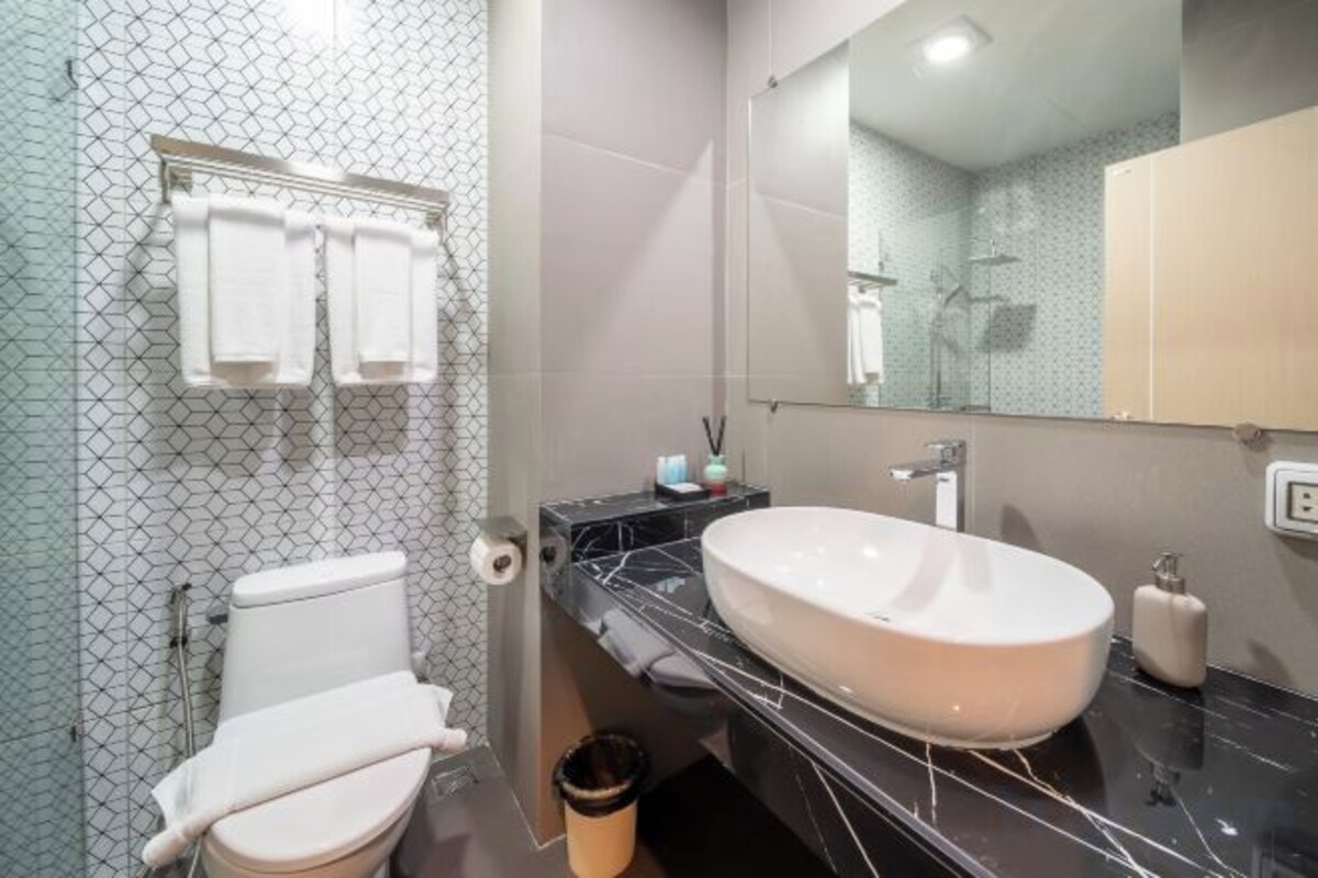 Shower, free toiletries, hair dryer, slippers