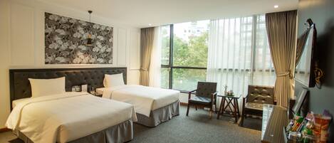 Standard Twin Room | Minibar, in-room safe, desk, blackout curtains