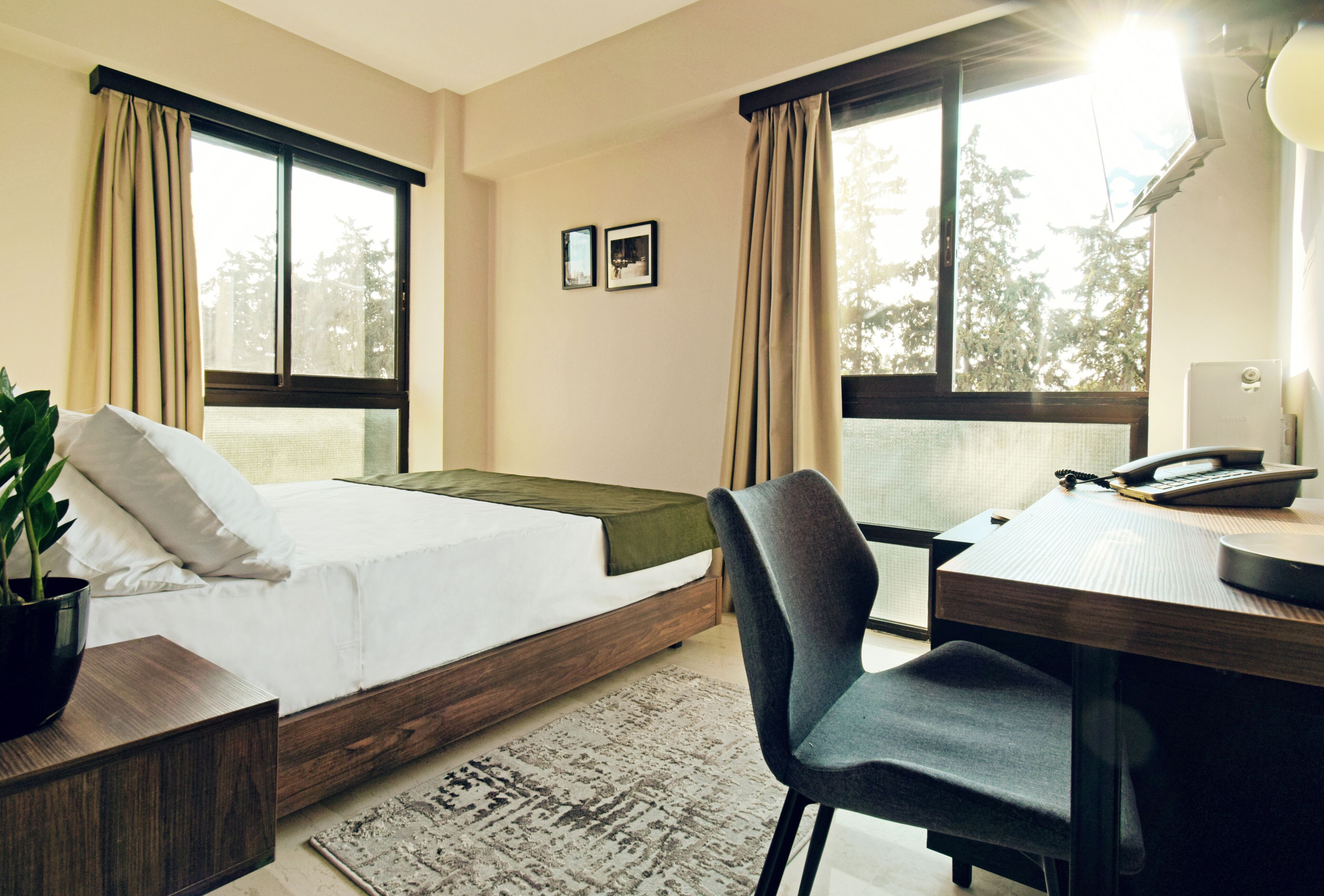 deluxe double room | in-room safe, desk, laptop workspace, blackout curtains
