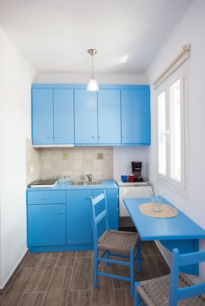 Fridge, coffee/tea maker, highchair, cookware/dishes/utensils