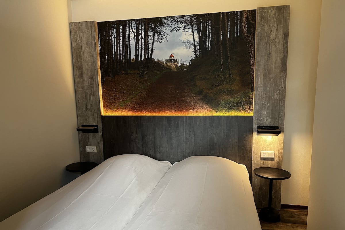 family apartment | desk, laptop workspace, blackout curtains, cots/infant beds