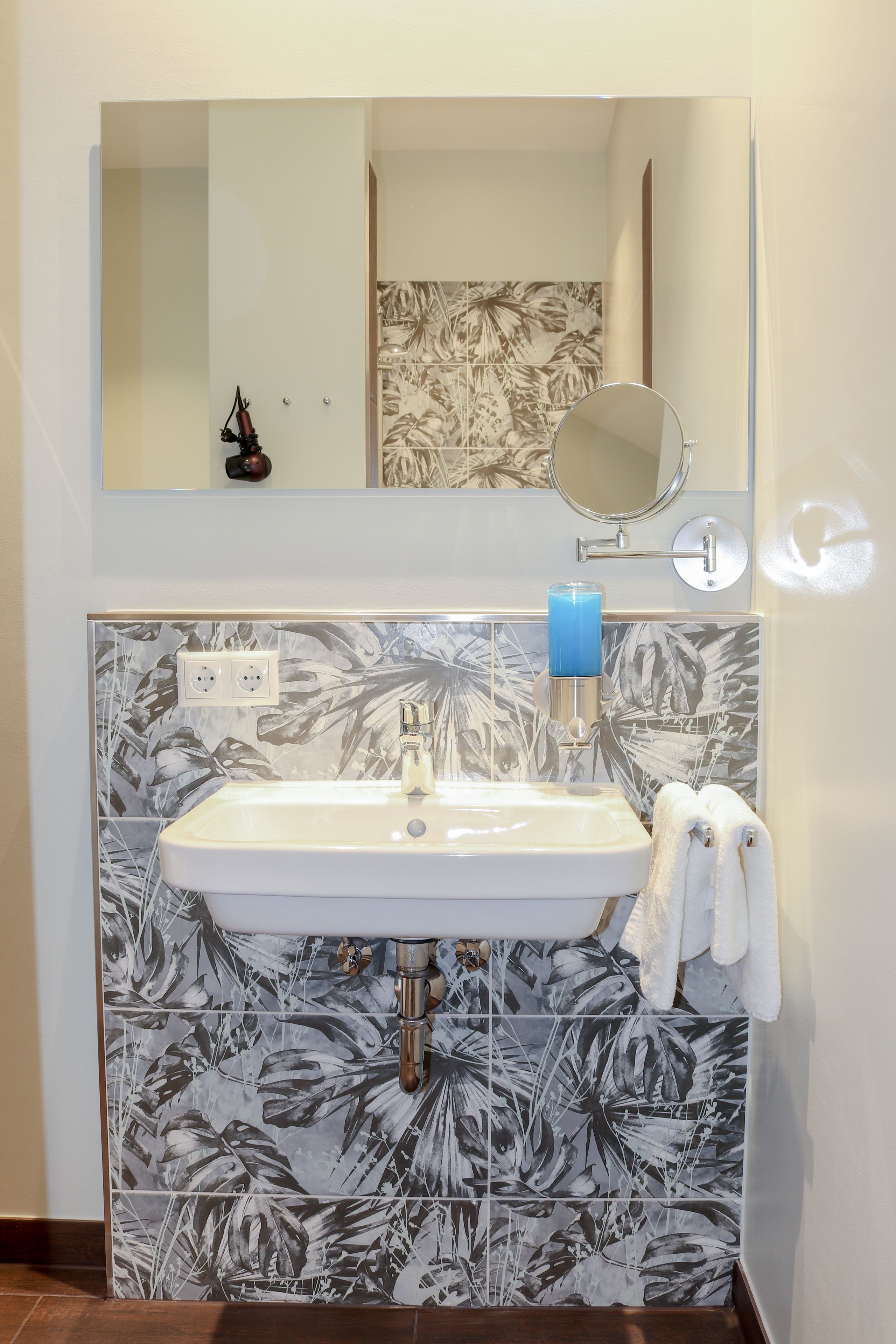 deluxe quadruple room | bathroom | shower, hair dryer, towels, soap