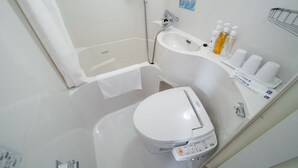 A modern bathroom with a bathtub, toilet, and sink. - Super Hotel Hachinohe Nagayokocho (Hachinohe)
