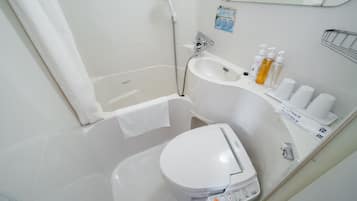 Combined shower/tub, free toiletries, hair dryer, slippers