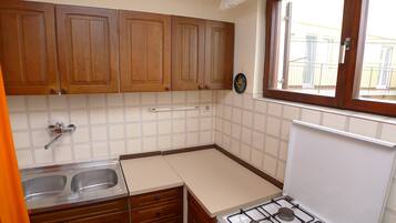 Appartamento (2 Bedrooms) | Cucina privata | Tavolo da pranzo