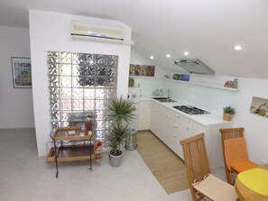 Apartment (1 Bedroom) | Private kitchen | Fridge, coffee/tea maker, cookware/dishes/utensils, cleaning supplies