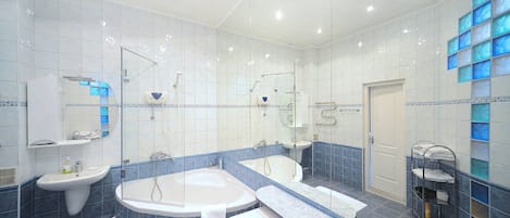 Combined shower/tub, hair dryer, towels, soap