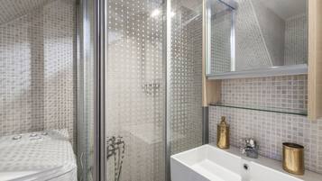 Shower, hair dryer, towels, soap