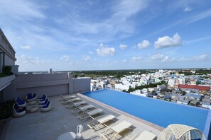 Outdoor pool, open 8:00 AM to 8:00 PM, sun loungers