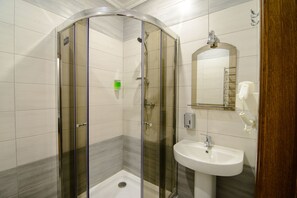 Economy Double Room, Shared Bathroom (B) | Bathroom | Shower, hair dryer, slippers, towels - Premium Hostel (Lviv)