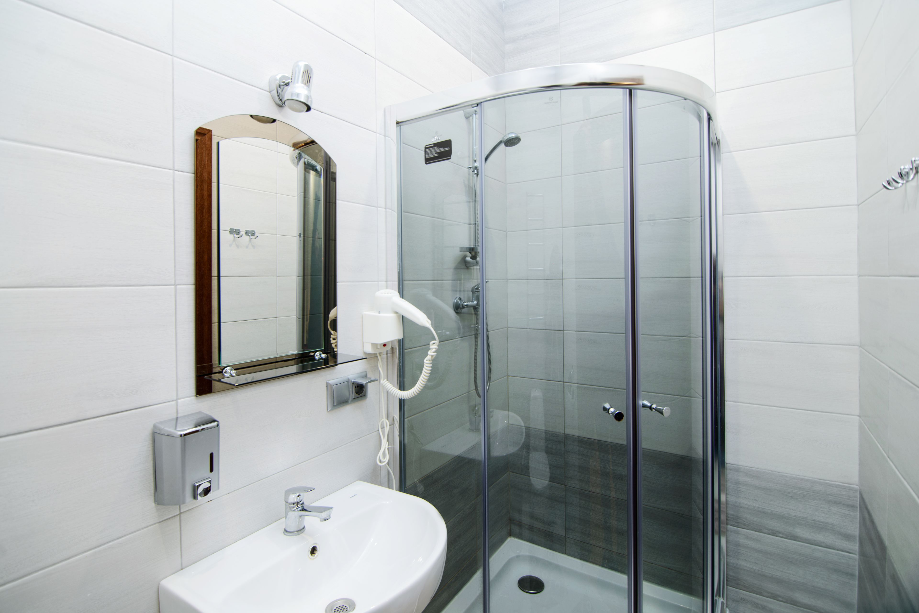 Shower, hair dryer, slippers, towels