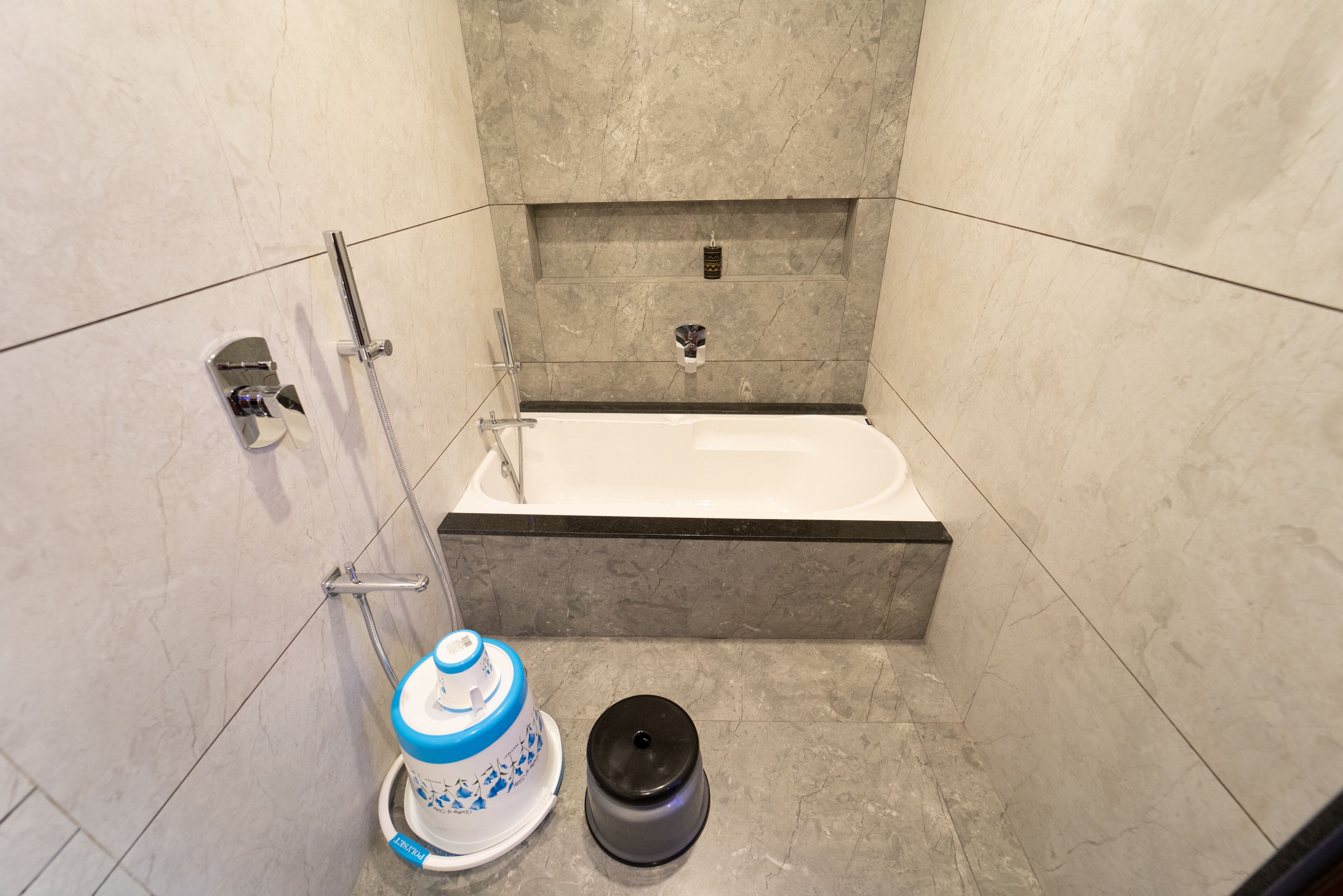 A bathroom with a bathtub, a shower, and a toilet.