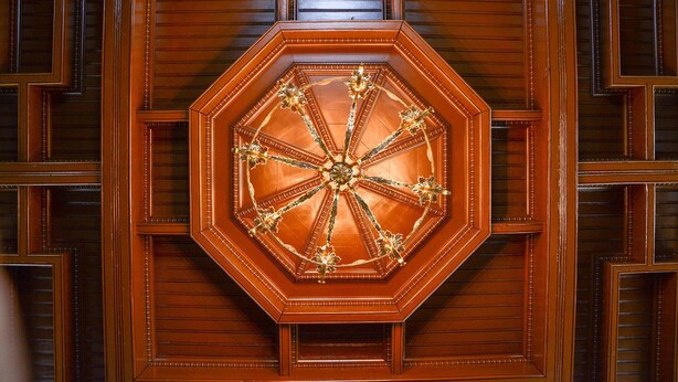 A wooden ceiling with a geometric pattern and a central decorative element. - The Towers Bed & Breakfast (Milford)