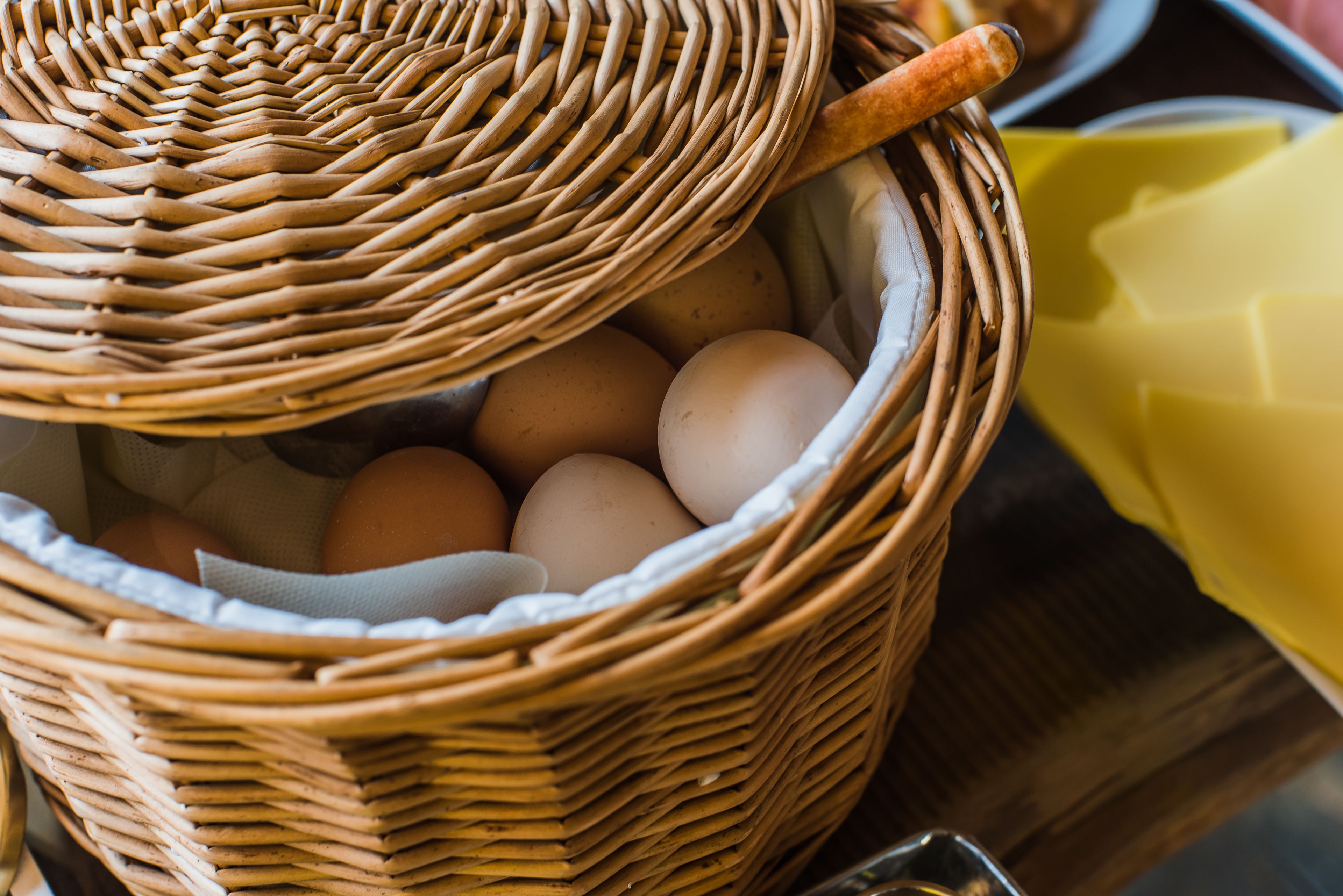 A wicker basket containing eggs.