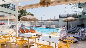 Seasonal outdoor pool, pool umbrellas, pool loungers