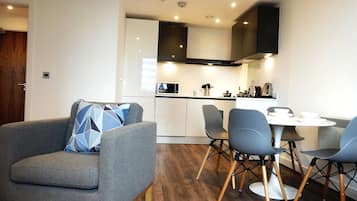 Deluxe Apartment, 1 Bedroom, City View | Living area | Flat-screen TV, DVD player