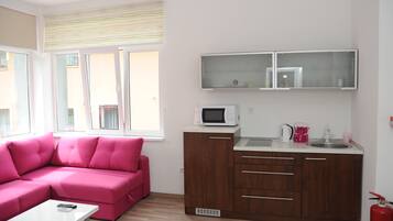 Standard Apartment | Living area | Flat-screen TV