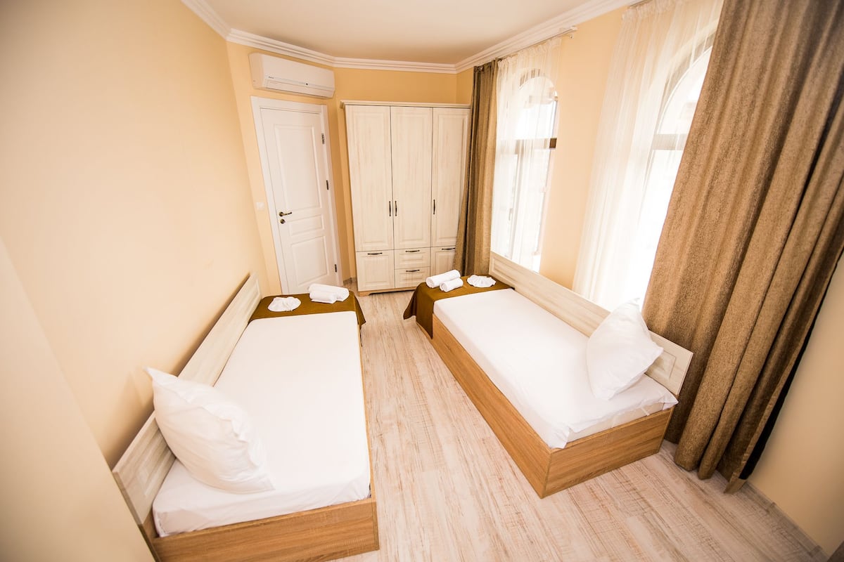 Apartment, 2 Bedrooms, Balcony, Partial Sea View | Living area | Flat-screen TV
