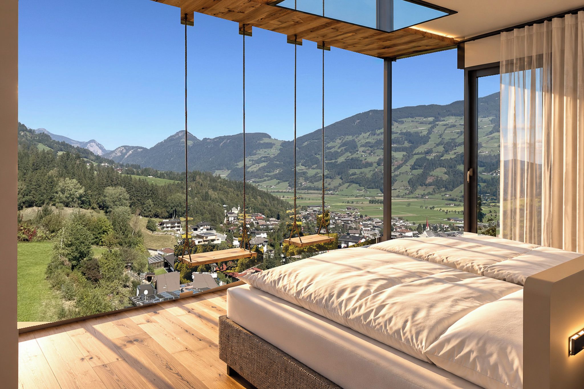 Een slaapkamer met een groot bed, houten vloeren en uitzicht op een bergachtig landschap.